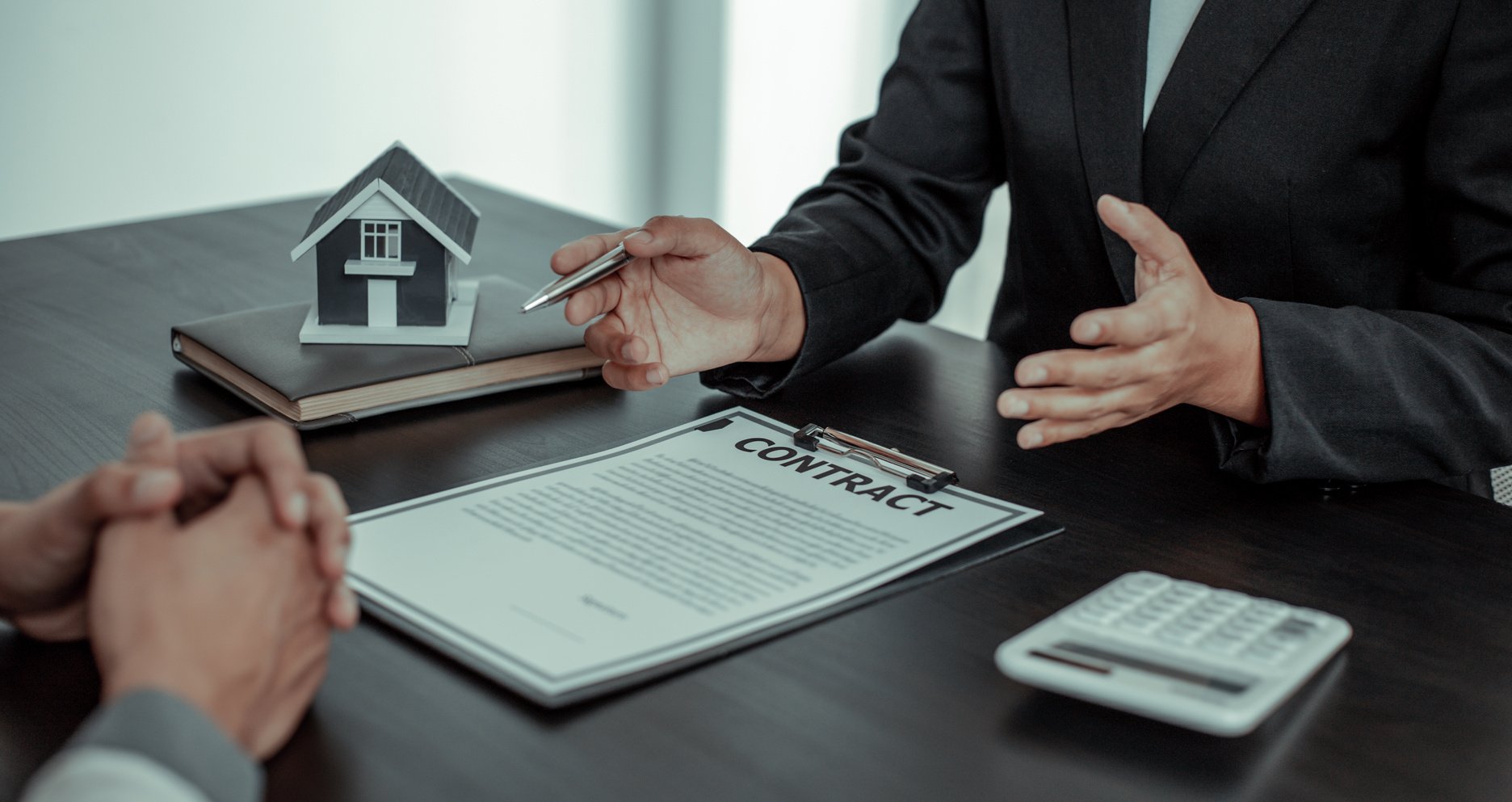 Real Estate Agent Showing Contract to Client